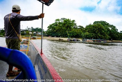 amazon jungle river view from a canoe on motorcycle tour in ecuador