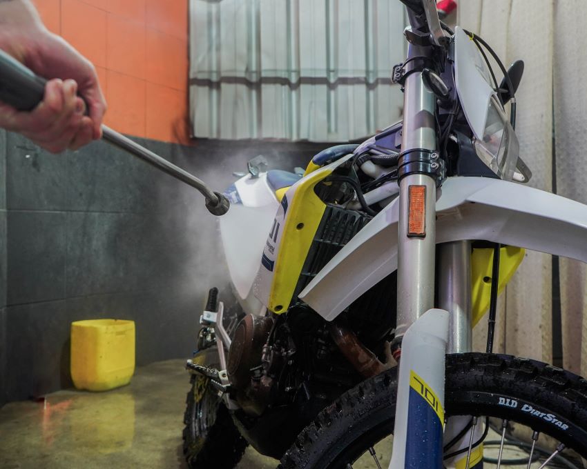 washing a husqvarna 701 at ecuador freedom bike rental