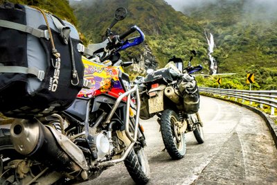 two bikes with waterfall in sangay national park