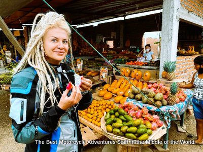 egle at a fruit stand in Ecuador