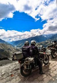 Motorcycle with view of banos ecuador below