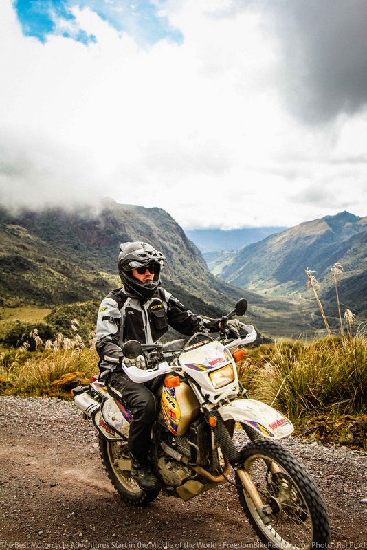 dirt bike riding through a beautiful park in ecuador