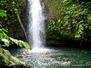 swimming in a waterfall laguna in Ecuador